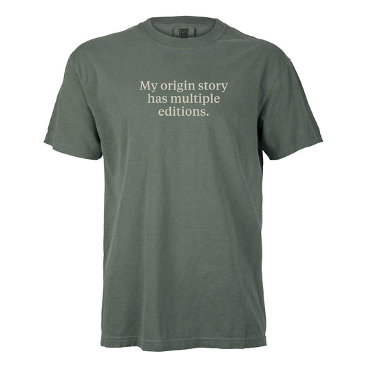 My origin story has multiple editions. | T-shirt